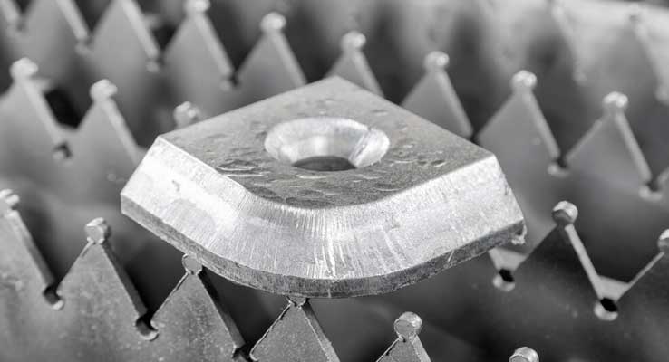 Fiber laser cutting sample on laser bed